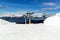 Chairlift in the Italian Alps. Chair lift in snowy mountains at nice sunny day.