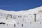 Chairlift at Italian ski area on snow covered Alps and skiers and snowboarders on the piste - winter sports concept