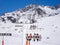 Chairlift in mountains under snow