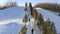 Chairlifts on a hillside, a ski lift on a mountainside on a winter day.