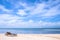 Chairs on the amazing beautiful sandy beach near the ocean with blue sky. Concept of summer leisure calm vacation for a tourism