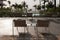 Chairs on the balcony with view to the beach and ocean