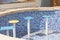 Chairs in empty tiled pool