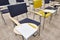 Chairs with notepads in empty classroom