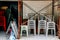 Chairs piled up in remodeling construction store at Lamma island village in Hong Kong