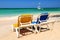 Chairs on sandy tropical beach