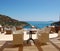 Chairs at sea view relaxation area of luxury hotel