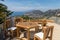 Chairs and table on the terrace overlooking the Bay of Naples and Vesuvius. Sorrento.