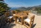 Chairs and table on the terrace overlooking the Bay of Naples and  Vesuvius. Sorrento.