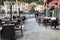 Chairs and tables of Italian cafe at coast of Portofino town, Liguria, Italy