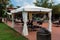 Chairs and Tables under Gazebo with White Tent