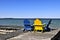 Chairs on wooden dock at lake