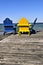 Chairs on wooden dock at lake