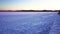 Chaise-lounges covered with snow. Winter Moscow cityscape panoramic view at sunset. Strogino region floodplain.