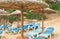 Chaise Lounges and straw umbrellas on the beautiful sandy beach of Palma de Mallorca