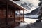 chalet exterior of the winter with wooden veranda in mountains by lake