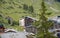 Chalet hotels in swiss village on the hillside in Alps, Switzerland.