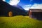 Chalet and tree on lawn