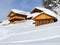 Chalets in the middle of the snow high in the italian Dolomites