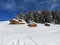 Chalets and mountain houses in the middle of the snow high in th