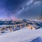 Chalets in the mountains at night under the stars