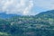 The chalets in the town of Combloux in the Mont Blanc Massif in Europe, France, the Alps, towards Chamonix, in summer, on a cloudy