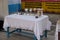 Chalices arranged beside the altar before the mass in the church in the village of Kumrokhali, India