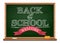 Chalk on a blackboard. Welcome. Back to school