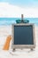 Chalk board sunscreen cream sand beach tropic