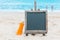 Chalk board sunscreen cream sand beach tropic