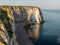 Chalk cliffs of Etretat with the natural arch called Manneporte