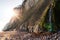 Chalk cliffs with waterfall lit by sun rays in Jasmund National Park on the German island Ruegen