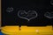Chalk drawing board with drawn hearts