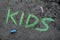 Chalk drawing: Green word KIDS