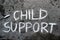 Chalk drawing: words CHILD SUPPORT