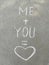 Chalk inscription on the asphalt me plus you is love. heart, message, recognition, summer, wedding, valentine. card