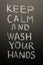 Chalk inscription on the blackboard - keep calm and wash your hands. Coronavirus and danger of getting sick