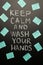 Chalk inscription on the blackboard - keep calm and wash your hands. Coronavirus and danger of getting sick