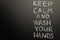 Chalk inscription on the blackboard - keep calm and wash your hands. Coronavirus and danger of getting sick. With space for