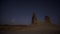 Chalk and limestone remnants in the Kazakh steppe at night against the background of the starry sky and the moon