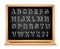 Chalkboard alphabet set on wooden blackboard