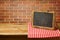 Chalkboard on checked tablecloth. Copy space for your text or message display