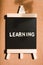 Chalkboard contain the words learning using as business and educ