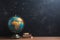 Chalkboard cosmos World globe stands out against a textured chalkboard