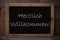 Chalkboard With Herzlich Willkommen Means Welcome