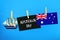 Chalkboard with the inscription: Happy day of Australia surrounded by shipwrights, a compass, a clock and an Australian flag on a