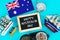 Chalkboard with the inscription: Happy day of Australia surrounded by shipwrights, a compass, a clock and an Australian flag on a
