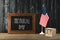 Chalkboard with memorial day lettering near american flag and wooden cubes