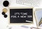 Chalkboard on office desk with text: IT\'S TIME FOR A NEW JOB