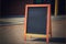 Chalkboard outside store with copy space on sidewalk, created using generative ai technology